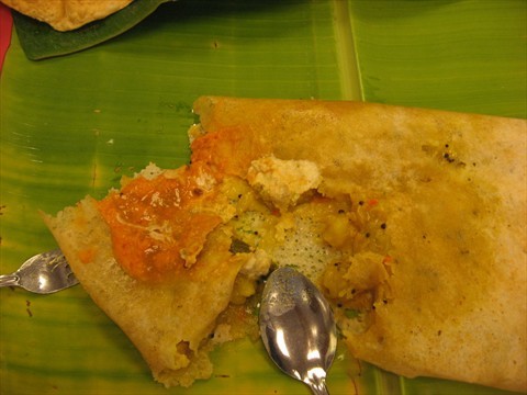 innards of thosai jammed with coconut chutney