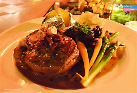 Beef steak serves with nachos, mash potato,grilled mushroom and asparagus.