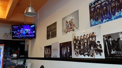 one wall full of K pop posters