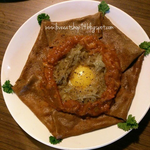 Savory crepe served with egg, Emmental cheese, tomato Coulis and onions. The moment it was served, i