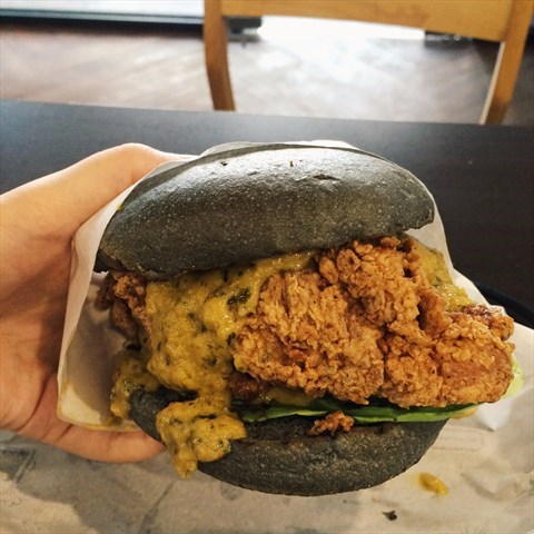 Juicy fried chicken with salted egg yolk sauce and lettuce