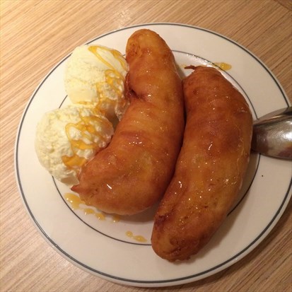 Deep fried banana with vanilla ice cream and golden syrup
