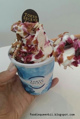 Soft serve with sort of ribena flavor and white chocolate toppings
