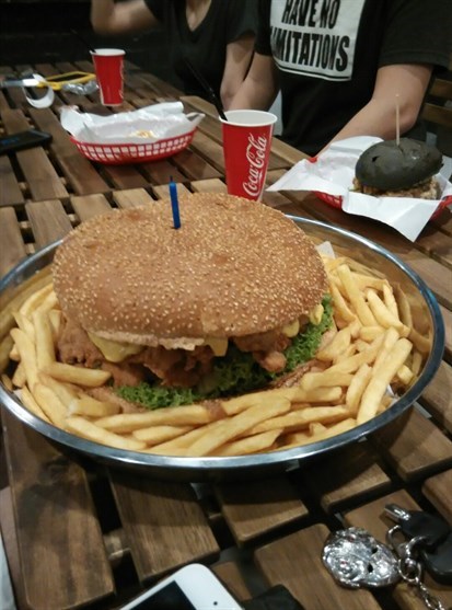 XXXXL Burger comes with fries.