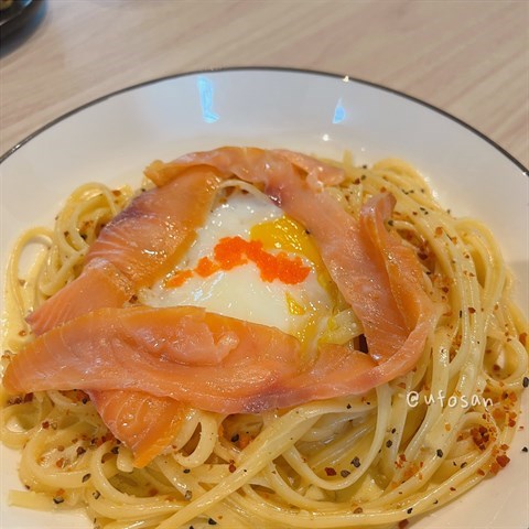 Classic  carbonara  linguine  with  soft-boiled  eggs,  ebiko  and  smoked  salmon.  